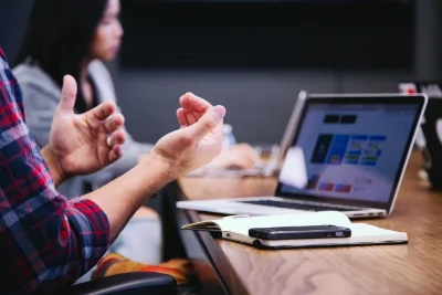 Men's hands in office meeting